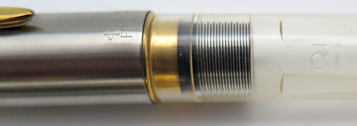 ITEM # 6691: FRONTIER SHOP PROTOTYPE FOUNTAIN PEN IN CLEAR PLASTIC WITH BRUSHED STAINLESS CAP AND GOLD PLATED TRIM. CARTRIDGE FILLER. NIB IS MEDIUM. 